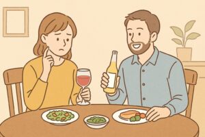 夕食のテーブルで夫婦が乾杯を迷うシーン